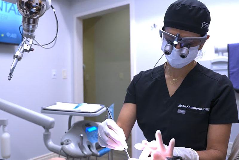 Dr.Melody Schiffer. working on a patient
