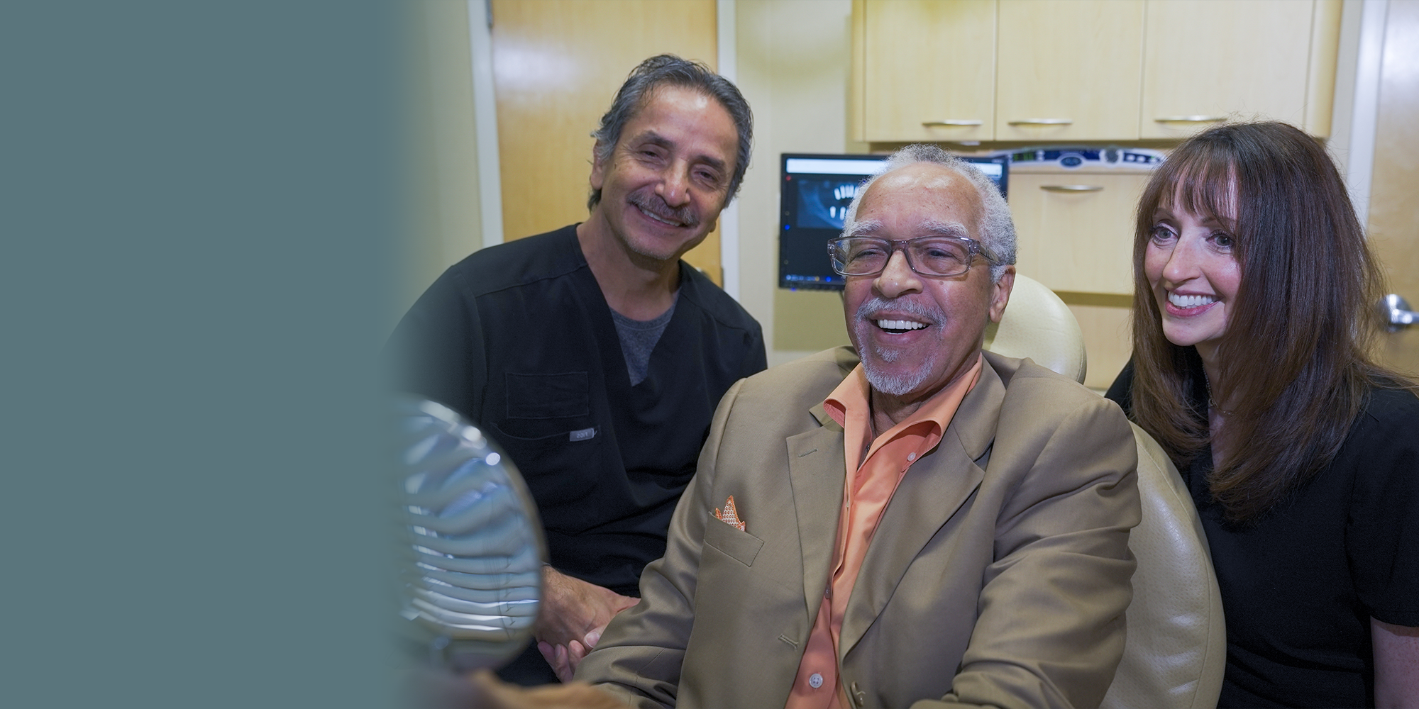 doctors and patient looking into mirror