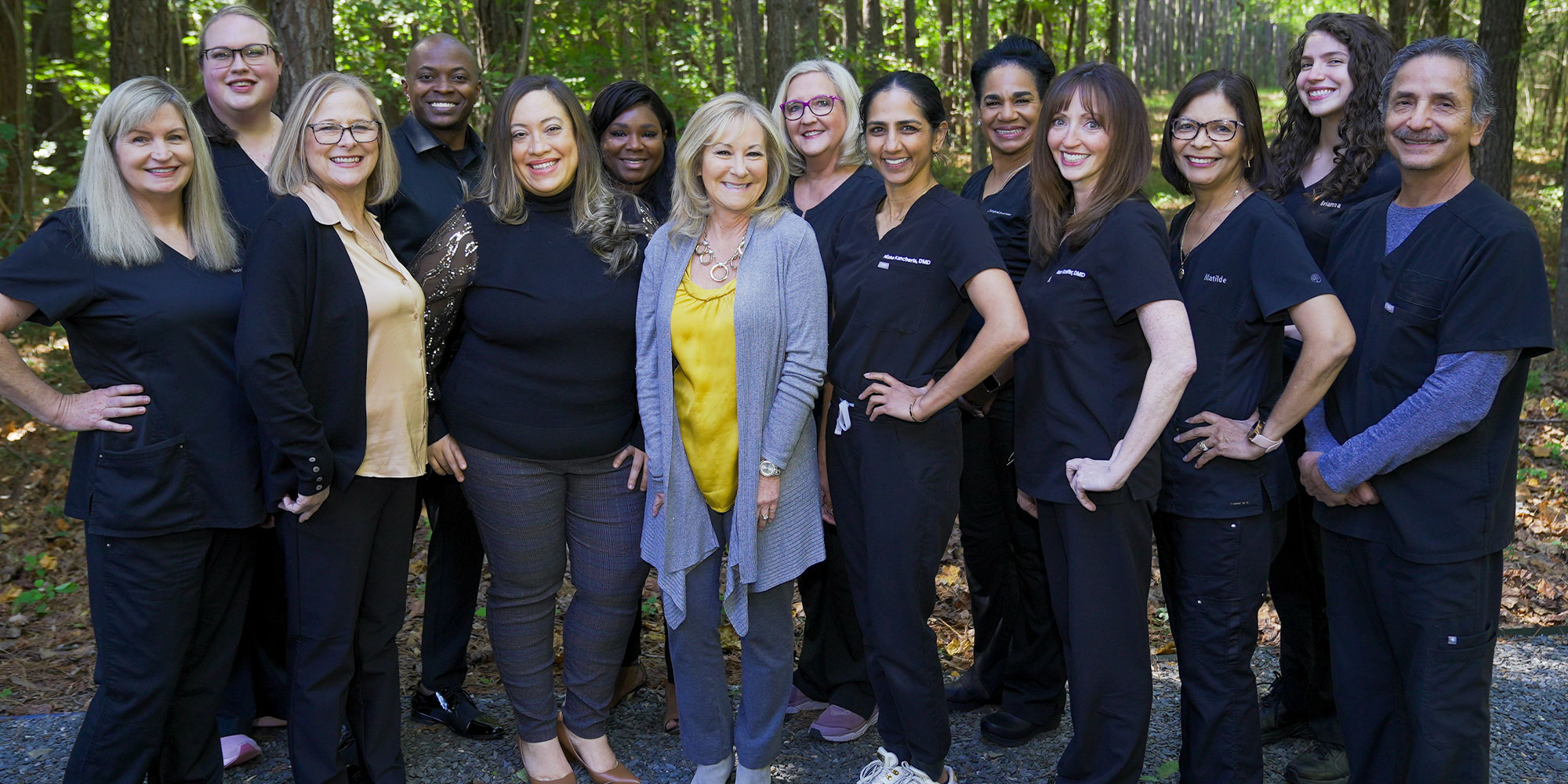 members of the dental practice taking picture outside